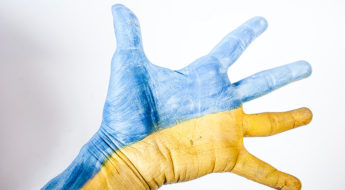 ukraine flag colours on outstretched hand