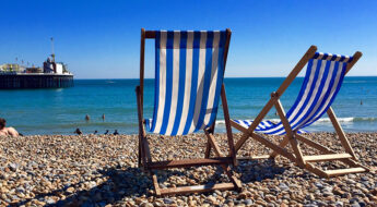 deckchairs on sunny Brighton beach