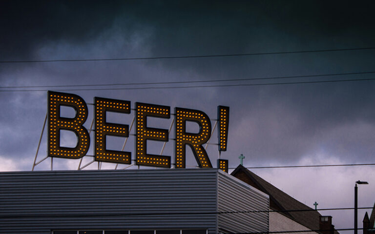 beer sign on top of a building